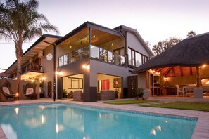 Outdoor pool, pool umbrellas, sun loungers