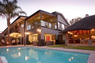 Outdoor pool, pool umbrellas, sun loungers