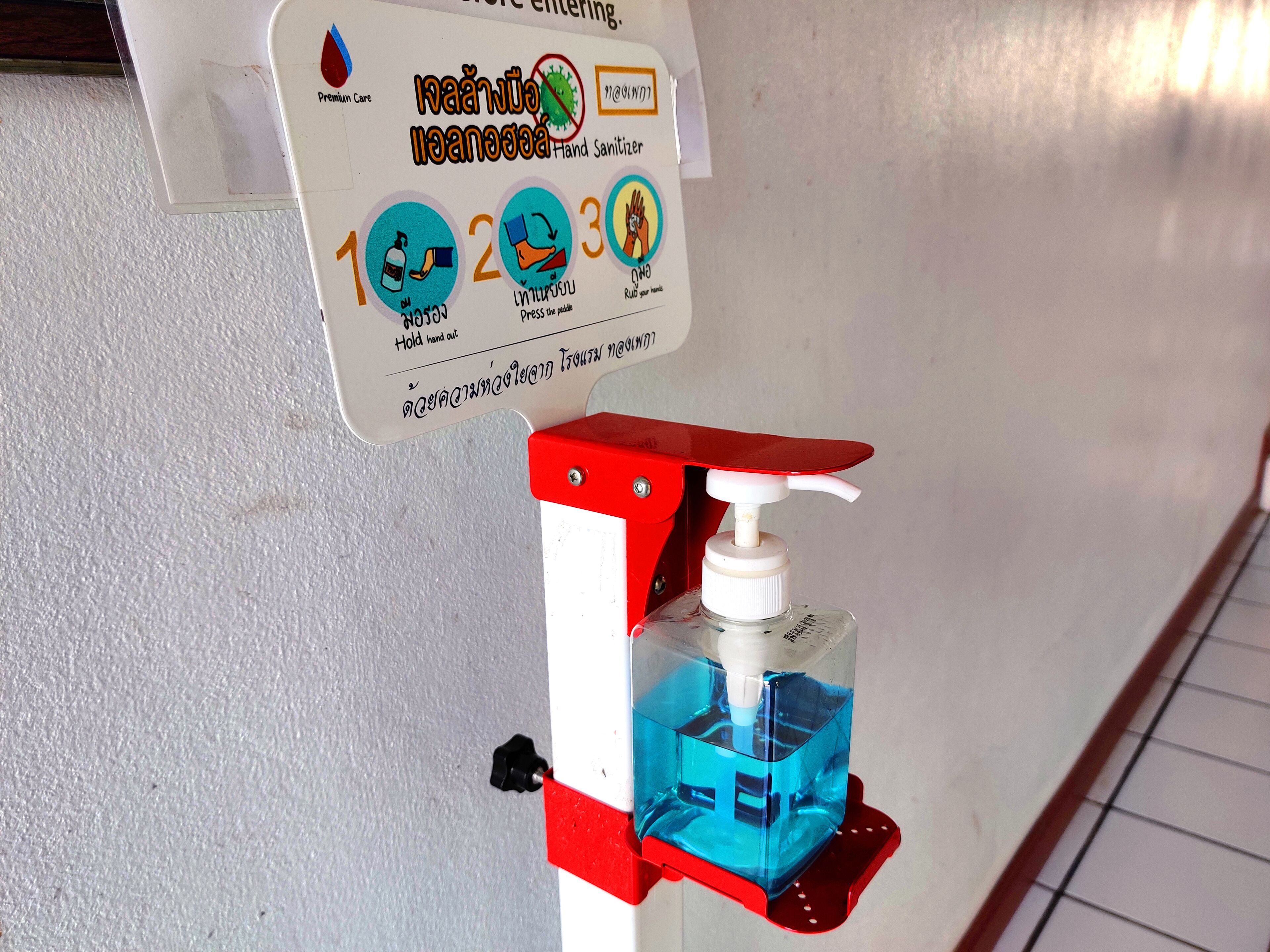 A hand sanitizer dispenser with instructions for use.