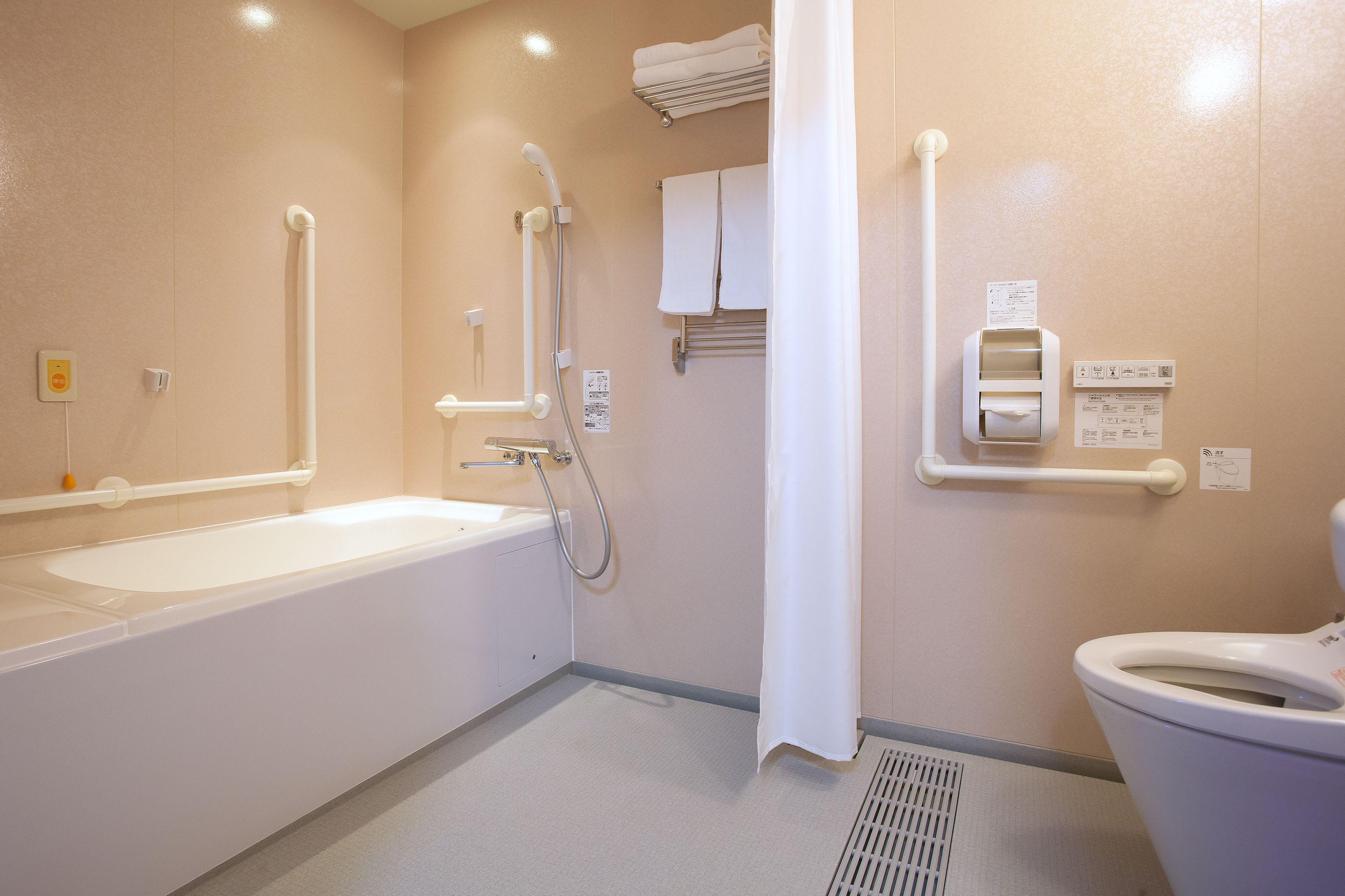 A bathroom with a bathtub, a shower, and a toilet.