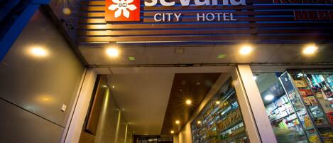 The Sevana City Hotel entrance with a visible car parked outside.