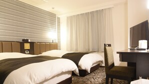 A hotel room with two beds, a desk, a chair, a television, and a window with curtains. - APA Hotel Kagoshima Tenmonkan (Kagoshima)