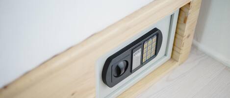 A wooden-framed wall with a built-in electrical outlet and switch panel.