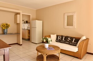 En 60-tommers Flatskjerm-TV med kabel-kanaler samt TV