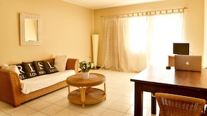 Basic Condo, 1 Bedroom | Living area | 60-inch flat-screen TV with cable channels, TV - Pega Pega Apartments (Oranjestad)