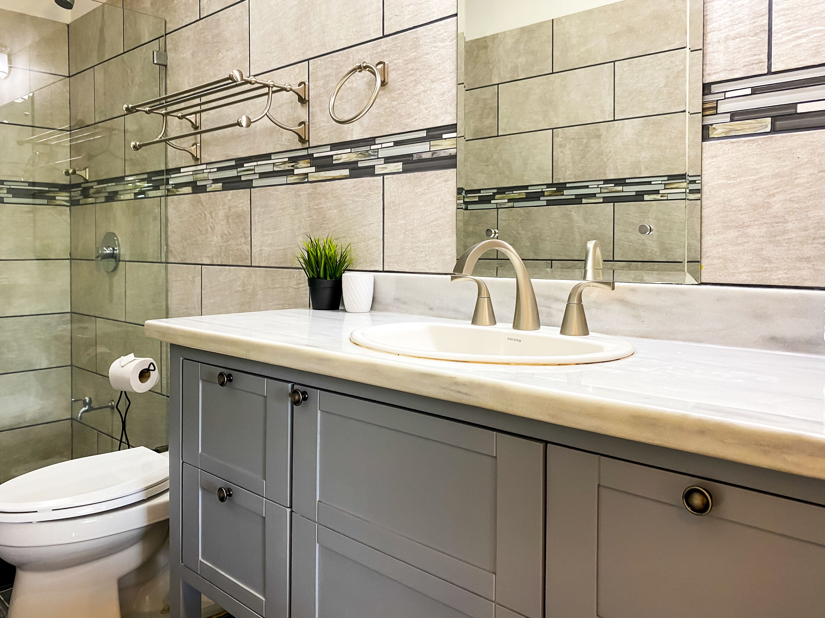 superior quadruple room | bathroom | rainfall showerhead, towels, soap, shampoo