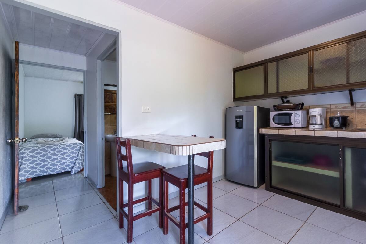 economy triple room, 1 bedroom | private kitchen | fridge