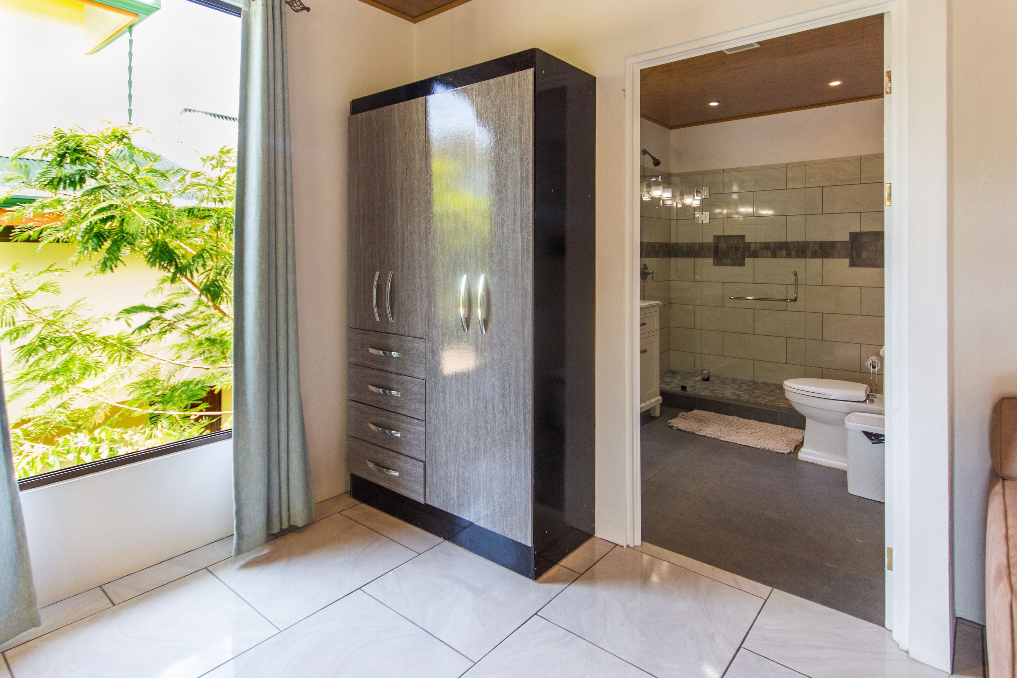 rainfall showerhead, towels, soap, shampoo