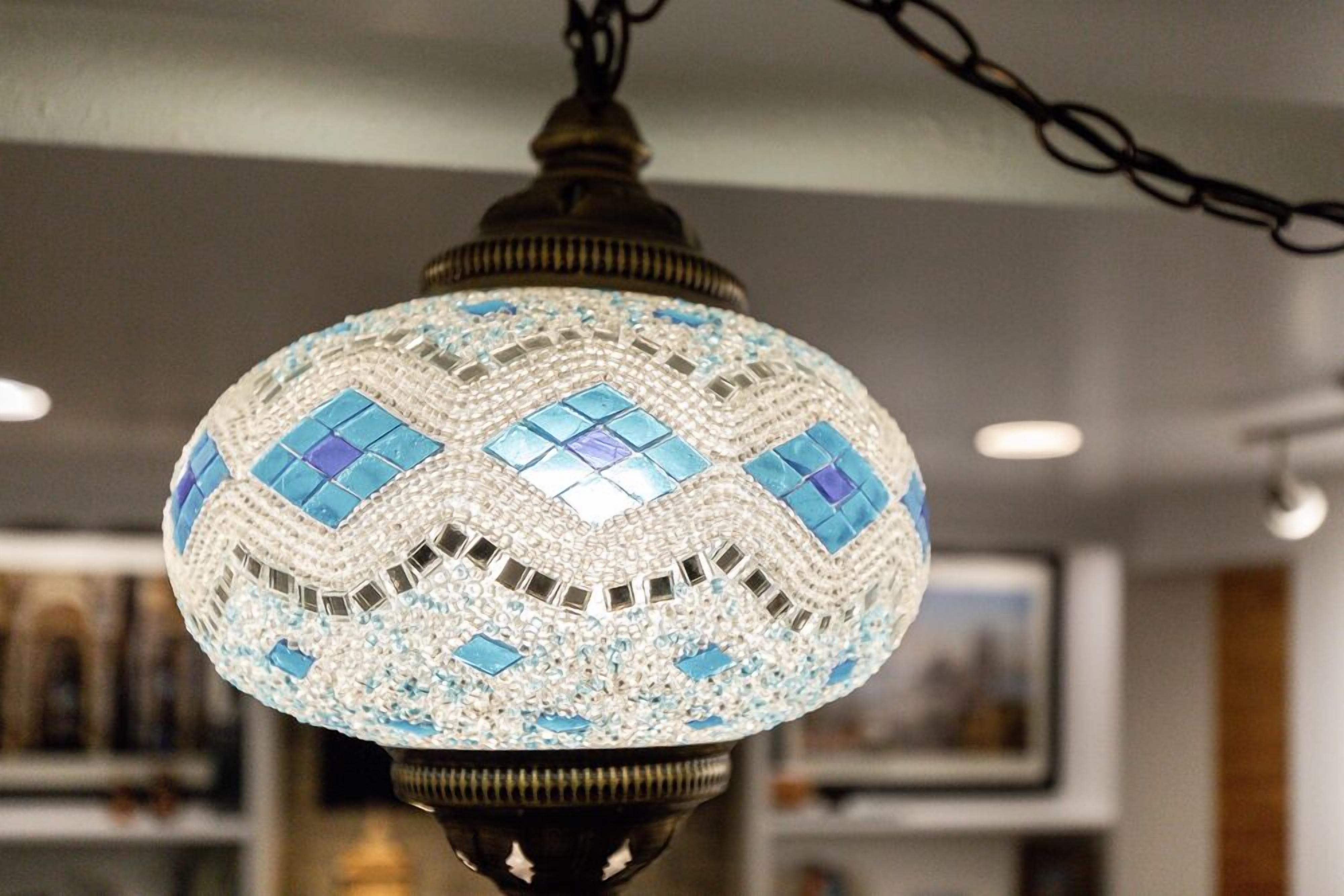 A hanging lamp with a mosaic design.