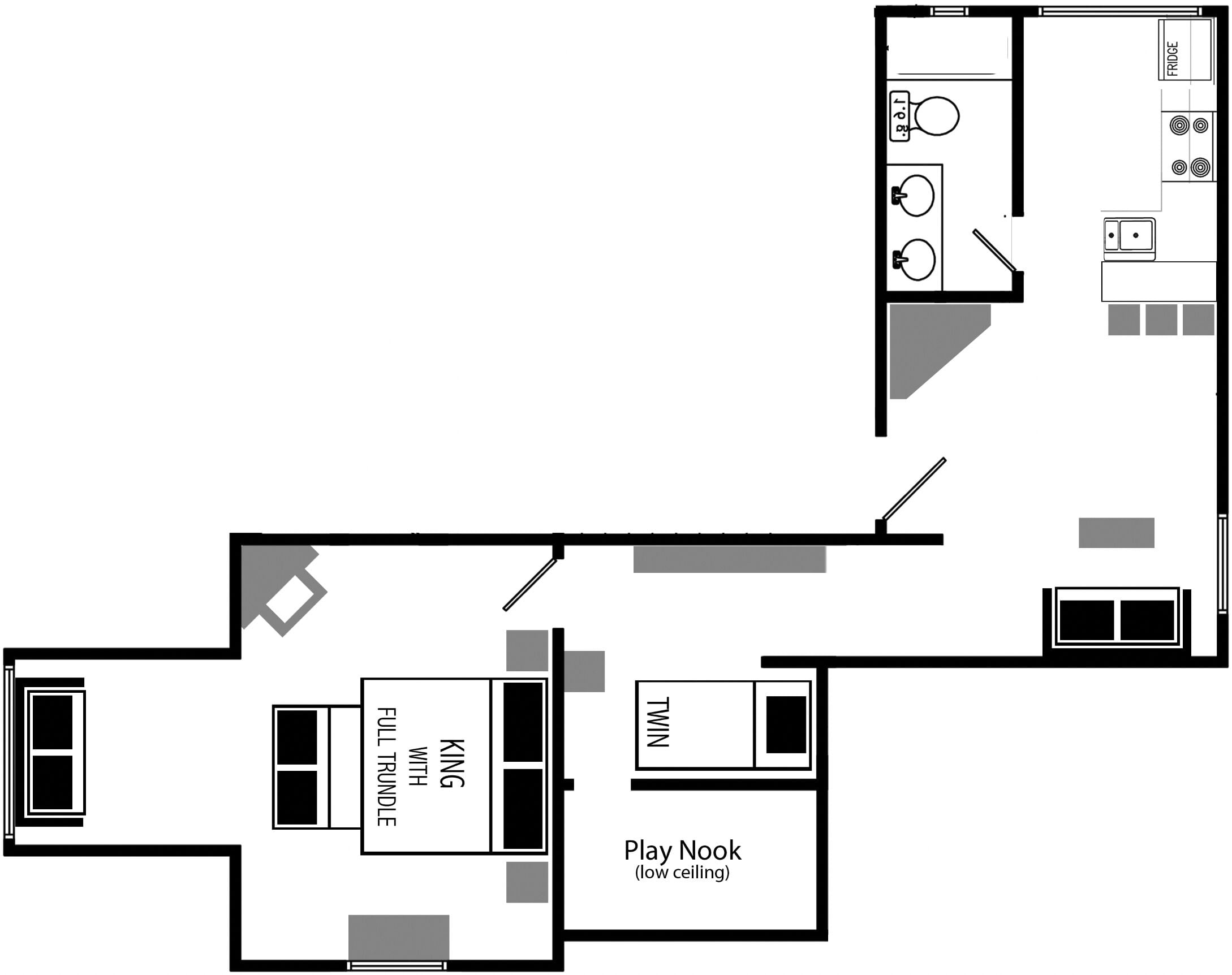 A floor plan with a kitchen, a play nook, and a dining area.
