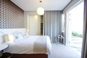 Deluxe Double Room, Patio, Courtyard Area (Room #3) | Minibar, in-room safe, desk, laptop workspace - Thirty on Grace (Cape Town)