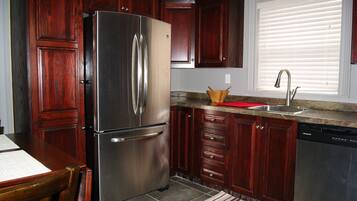Exclusive Apartment, 2 Bedrooms, Ground Floor | Private kitchen | Full-size fridge, microwave, oven, stovetop
