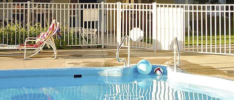 Seasonal outdoor pool, open 10:00 AM to 8:00 PM, pool loungers