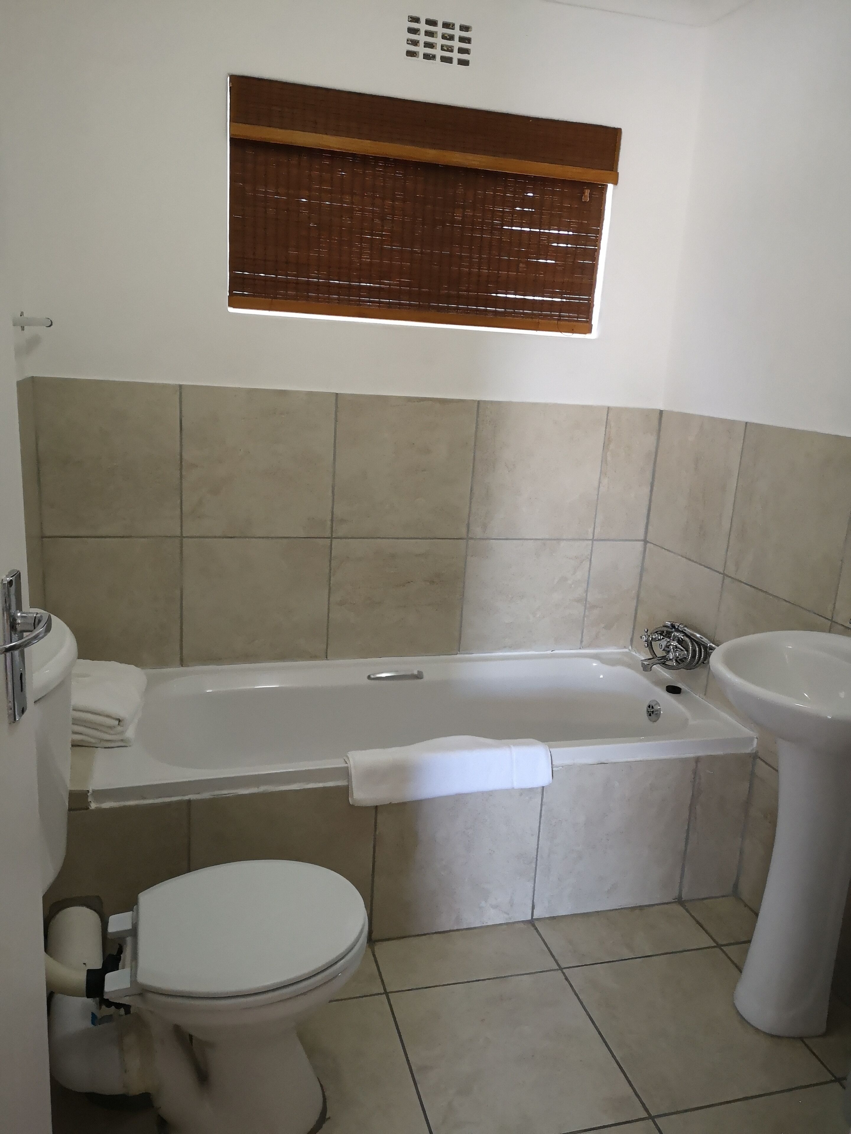 deep-soaking bathtub, rainfall showerhead, free toiletries, hair dryer