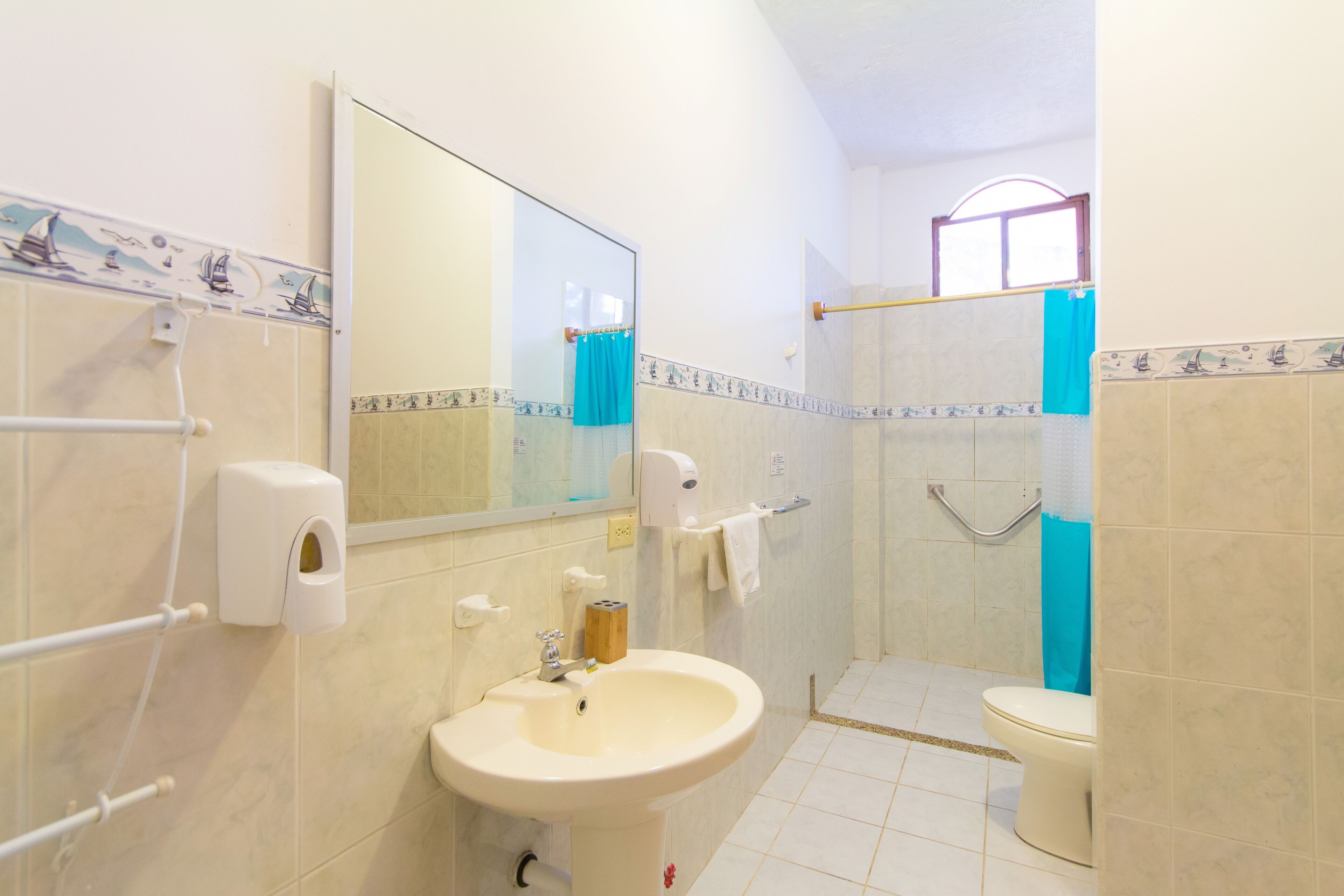 rainfall showerhead, hair dryer, towels, soap