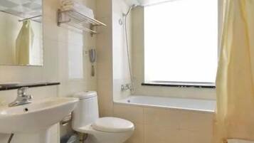 Combined shower/tub, free toiletries, slippers