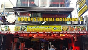 RAVANAN'S ORIENTAL RESTAURANT 2 with a signboard listing Indian, Lebanese, Thai, seafood, and European food options. - Rayaan Oriental Guest House & Restaurant (Patong)