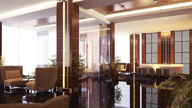 A modern lobby with a reflective floor, seating area, and decorative wooden panels. - Demelia Hotel (Makassar)
