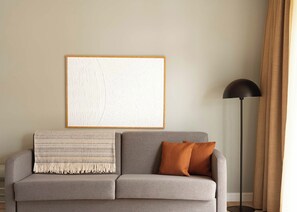 Suite with sofa bed & balcony | Living area | 50-inch flat-screen TV with cable channels, TV - Limehome Berlin Chausseestrasse (Berlin)