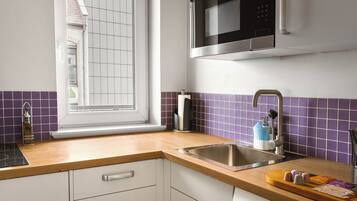 Comfort Suite with Sofa Bed and Balcony | Private kitchen | Coffee/tea maker, fridge, microwave, stovetop