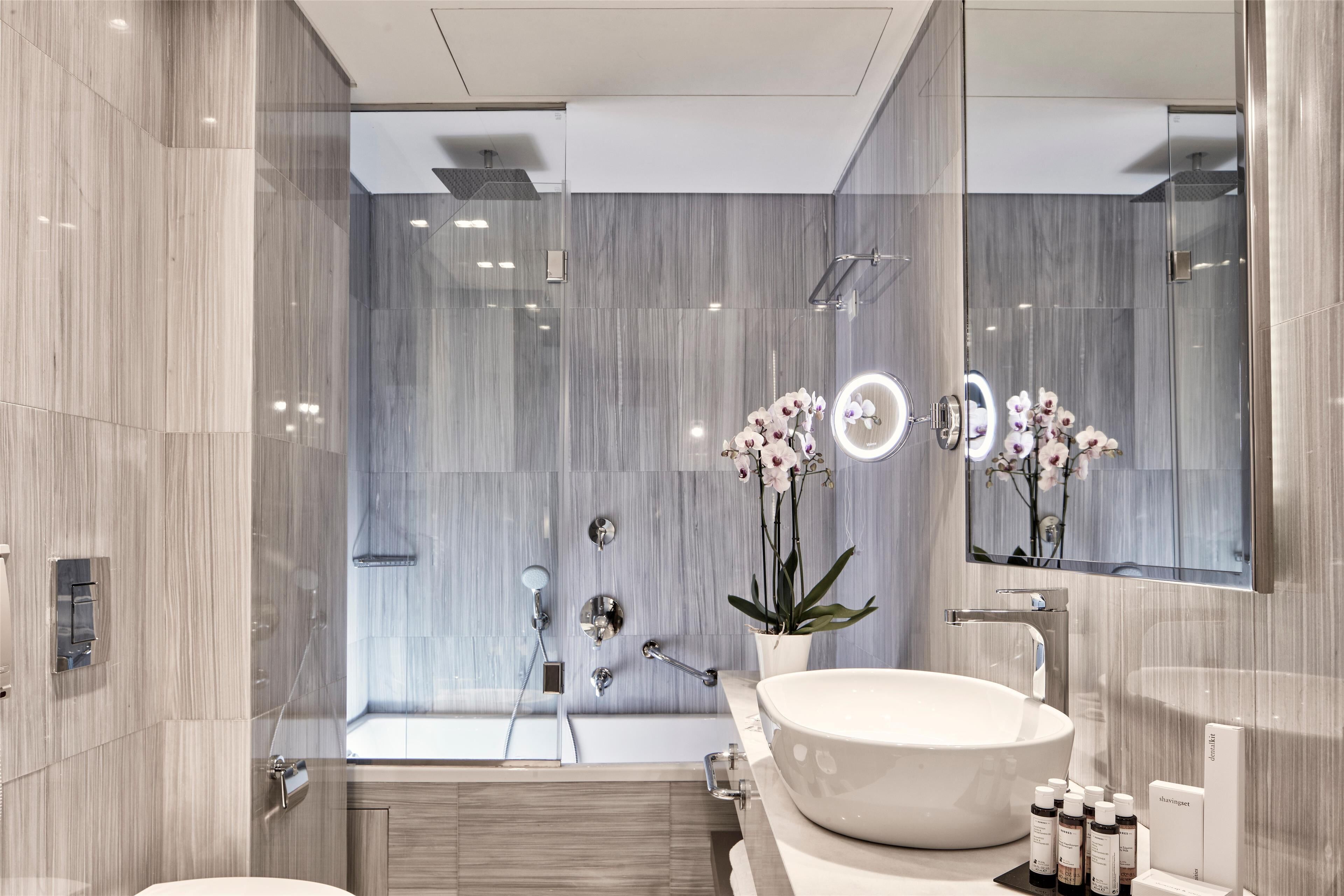 designer toiletries, hair dryer, bathrobes, slippers