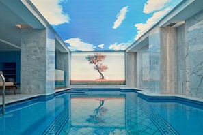Indoor pool, seasonal outdoor pool, pool umbrellas, pool loungers