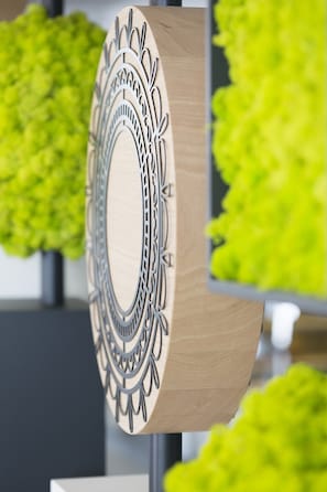 A wooden wall decor with intricate cut-out patterns.