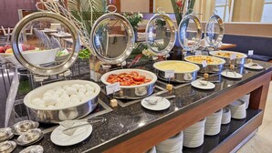 A buffet with various food items and serving utensils. - Park Dedeman Bostanci Hotel (Istanbul)