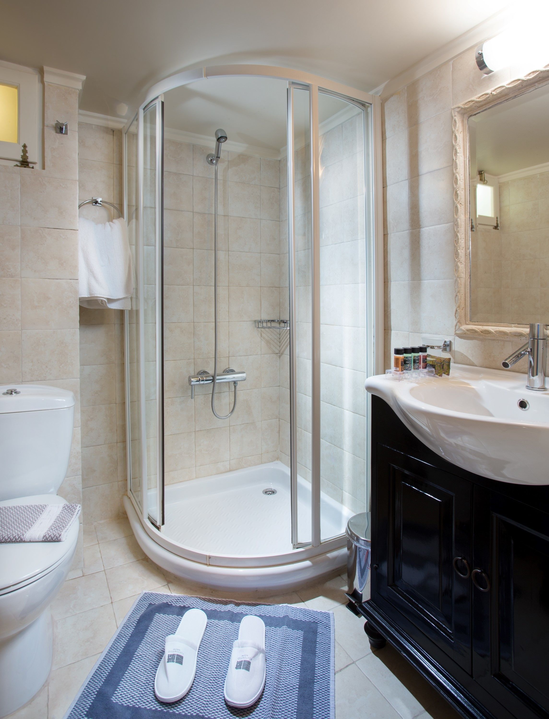 designer toiletries, hair dryer, towels