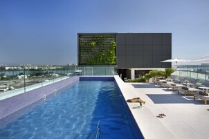 Outdoor pool, pool umbrellas, sun loungers