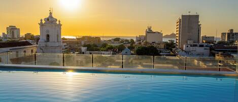 Outdoor pool, open 9:00 AM to 8:00 PM, pool loungers