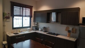 Villa, 3 Bedrooms, Pool View | Private kitchen | Full-size fridge, microwave, oven, stovetop - Paradise Pool Villa (Cha-am)