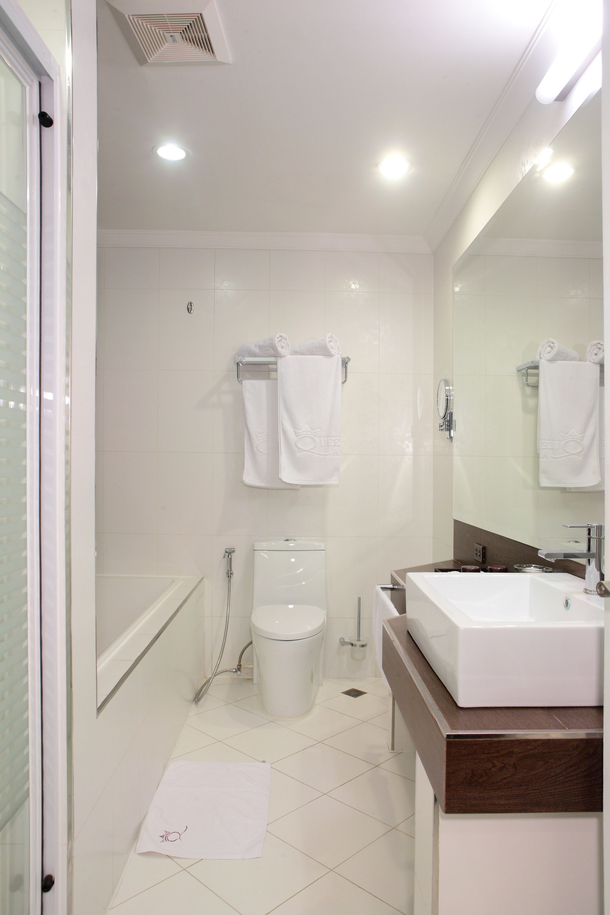 balcony executive | bathroom | slippers, bidet, towels
