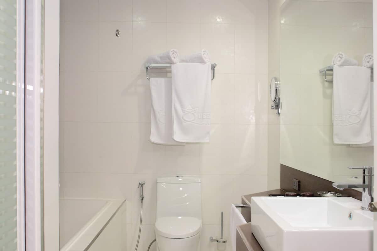 balcony executive | bathroom | slippers, bidet, towels