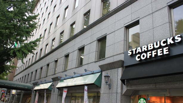 A building with a Starbucks Coffee sign, a green awning, and a sign for a hotel. - Hotel Grand Terrace Sendai Kokubuncho (Sendai)