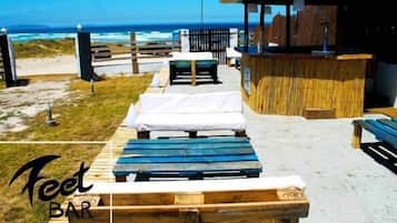 On the beach, white sand, windsurfing, beach yoga