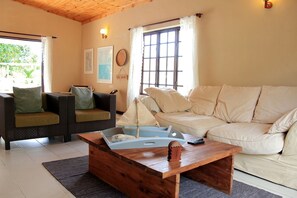 2 Bedroom Ground Floor Apartment | Living room | Flat-screen TV, DVD player - Castaway Lodge (Mahé Island)