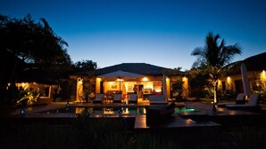 A resort with a swimming pool, lounge area, and a covered dining space. - Chuiba Bay Lodge (Pemba)