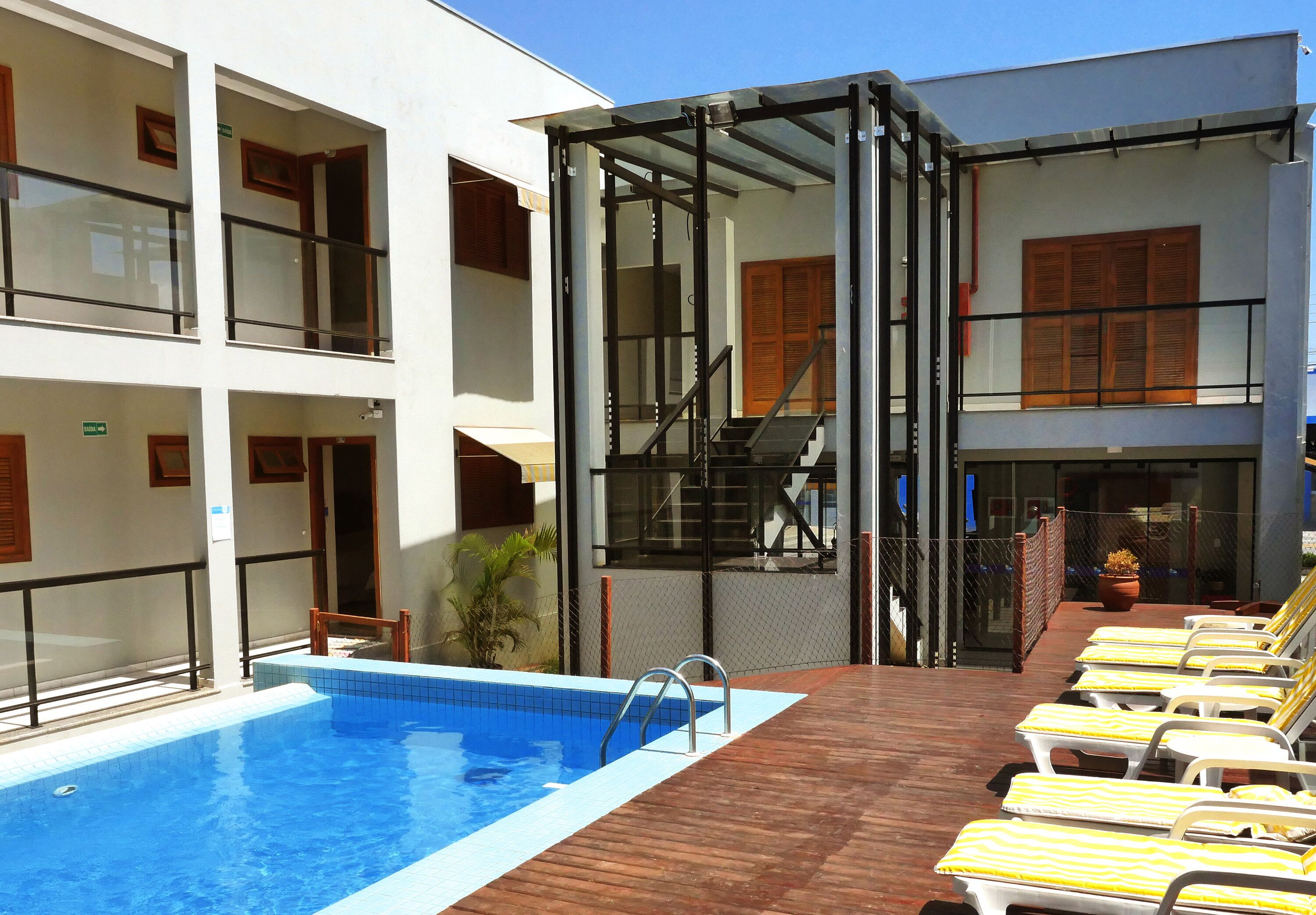 outdoor pool, open 9:00 am to 10:00 pm, pool umbrellas, pool loungers