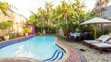 Seasonal outdoor pool, pool umbrellas, pool loungers