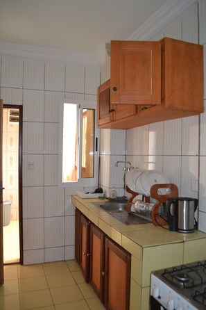 Apartment, 1 Bedroom | Private kitchen | Full-size fridge, microwave, stovetop, coffee/tea maker - Meumi Residence (Yaoundé)