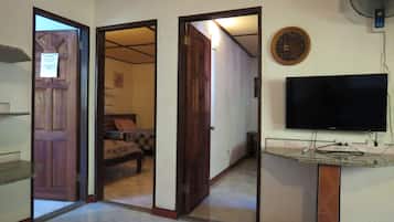 Deluxe House, 2 Bedrooms, Kitchenette, Poolside | Living room | 32-inch flat-screen TV with cable channels, TV