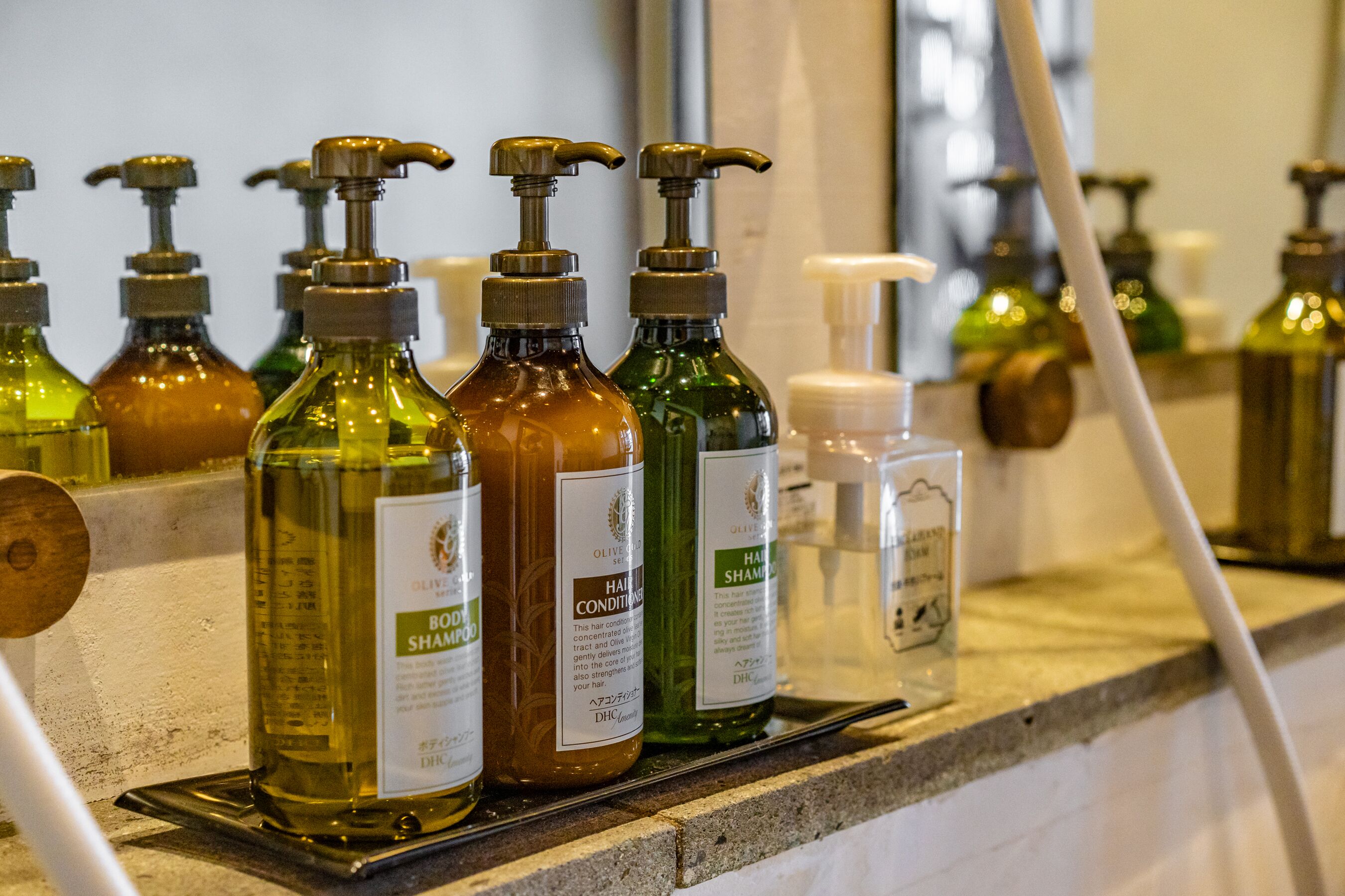 A variety of hair care products on a countertop.