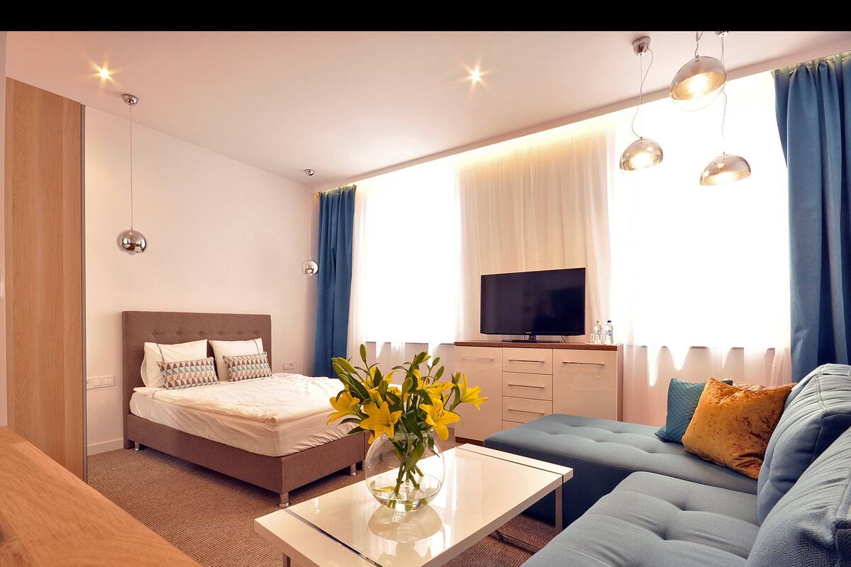 Superior Suite, Kitchen, City View | Living room | Flat-screen TV