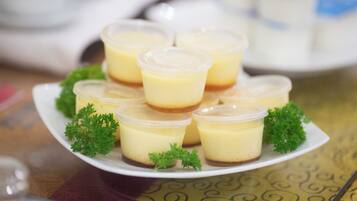 A plate of custard cups with a garnish of parsley.