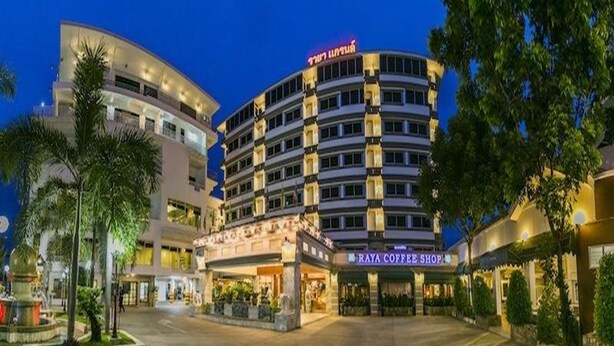 A hotel with multiple floors, a coffee shop, and a well-lit entrance area. - Raya Grand Hotel (Nakhon Ratchasima)