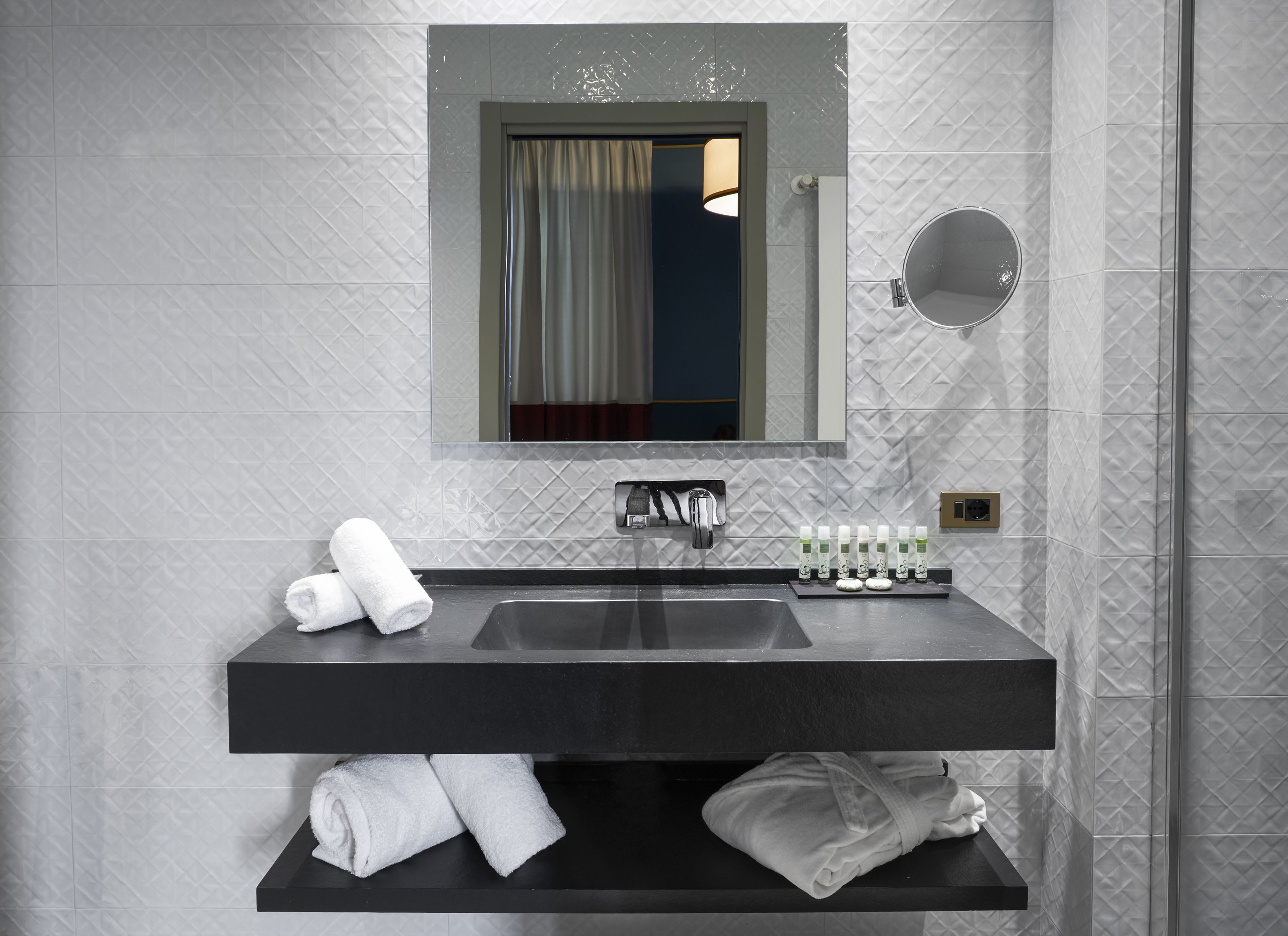 designer toiletries, hair dryer, slippers, bidet