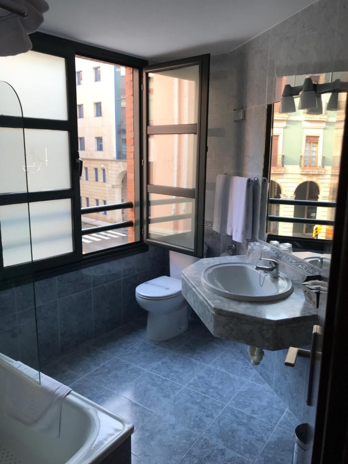 bathtub, free toiletries, hair dryer, towels