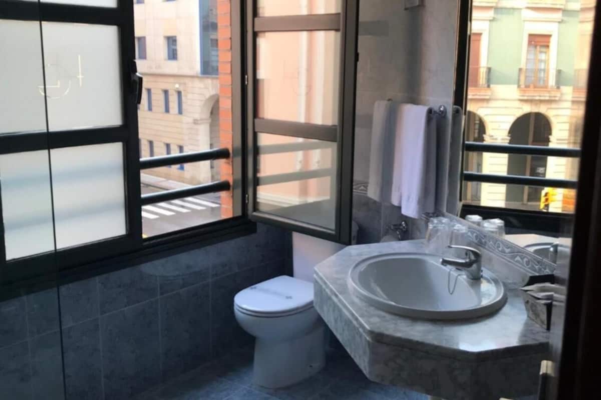 bathtub, free toiletries, hair dryer, towels