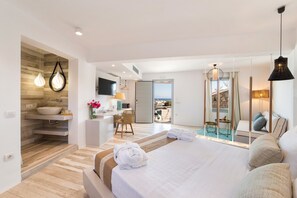 Suite Deluxe, vista al mar | Ropa de cama de alta calidad y minibar